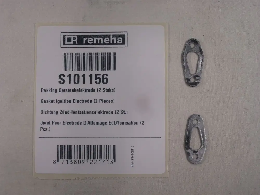 Zwei metallische Dichtungen von Remeha, auf einem Produktetikett mit Barcode und mehrsprachiger Beschreibung zur Verwendung in Zünd-Ionisationselektroden.